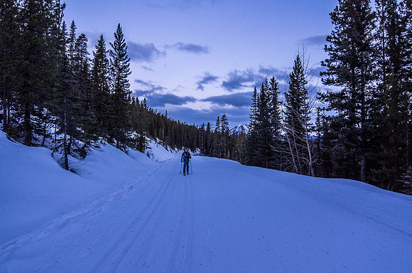 Skiing the icy Moraine Lake road.