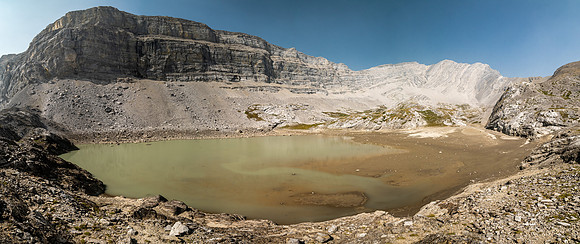 A muddy tarn under the south face of Puma.