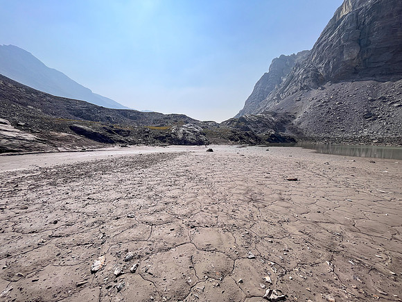 Hiking across mud flats under the south face of Puma.