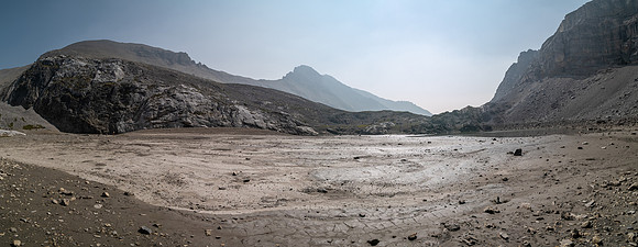 Hiking across mud flats under the south face of Puma.