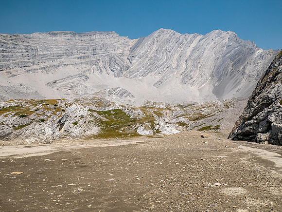 Hiking across mud flats under the south face of Puma.
