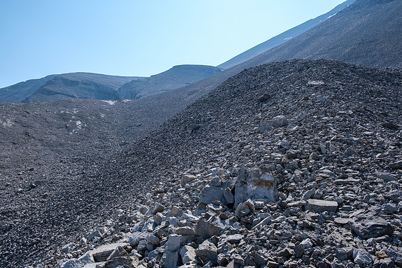 Ascending steep rubble slopes under the north face of HH89.