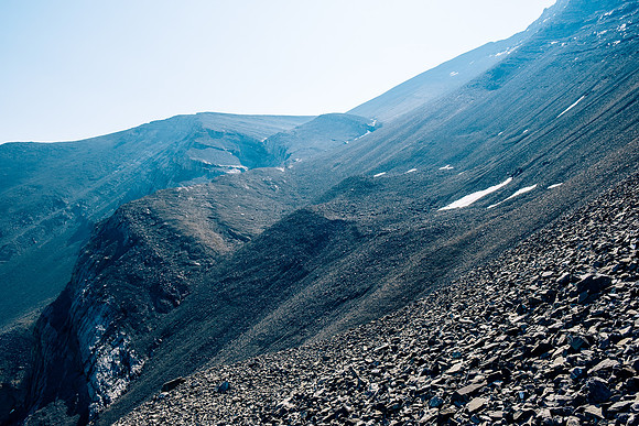 Ascending steep rubble slopes under the north face of HH89.