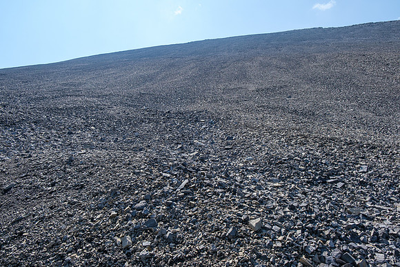 Ascending steep rubble slopes under the north face of HH89.