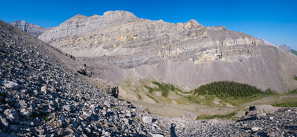 Traversing from the north ridge of HH89 towards Forbidden Lake.