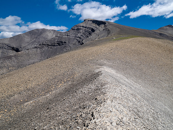 Descending west rubble slopes into the headwaters of Scalp Creek.
