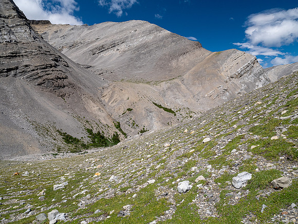 Descending west rubble slopes into the headwaters of Scalp Creek.