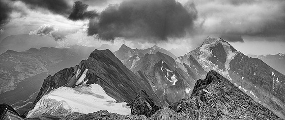 Dark clouds and smoke make for a dramatic scene towards the 3315m Sunwapta Peak with its striking north face. Jonas Creek far below at lower left.