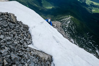 Phil comes up the exposed snow just above the crux.