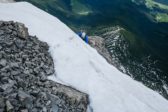 Phil comes up the exposed snow just above the crux.