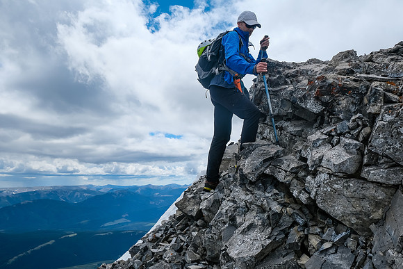 Ascending a small cliffband to the summit block.