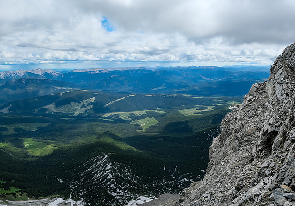 A wider but more exposed scree ledge over the east face.