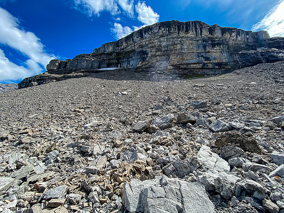 Cliffs loom above us at the end of the NW shoulder.