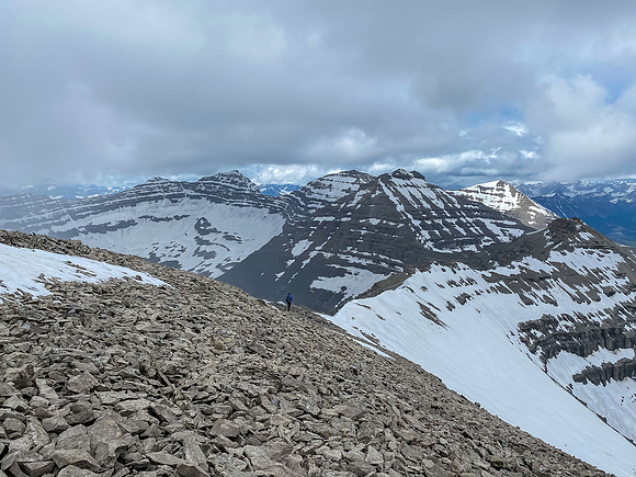 Phil is tiny on the west ridge as we traverse to the outlier between Baril and Cornwell.