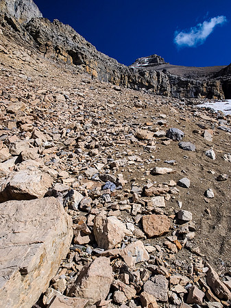 The summit rises far above - we cut left here.
