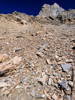 Looking left of the previous photo, Wietse is gaining height on loose scree to the upper mountain - he will soon traverse back to the right.