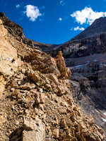 Following cairns as we work our way climber's left above the curtain wall to the summit.