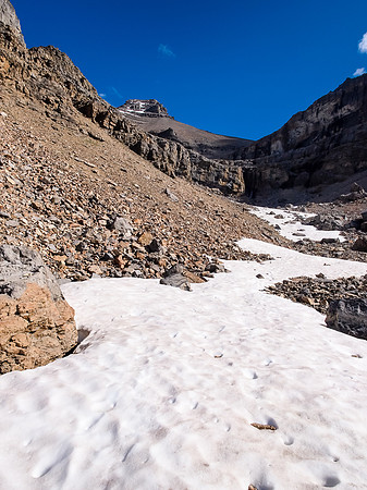 Obviously no easy route through the curtain wall ahead, we contoured left just ahead before proceeding to the summit at upper left.