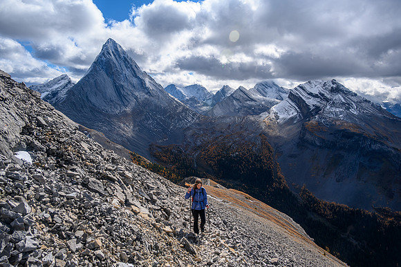 KC comes up the lower SE ridge with views of Birdwood, Sir Douglas and Snow Peak behind her.