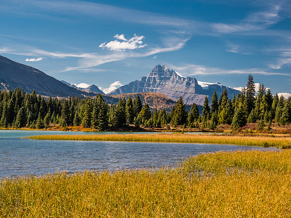 Mount Hector rises over the largest of the Red Deer lakes.