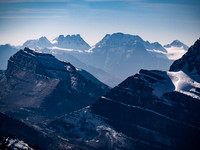 Bident and Quadra rise over Mount Redoubt at left with Mount Fay at center.