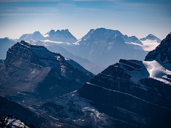 Bident and Quadra rise over Mount Redoubt at left with Mount Fay at center.