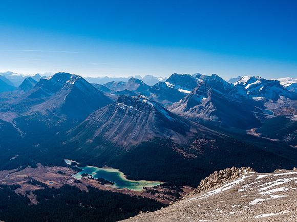 The sublime Red Deer Lakes with Fossil and Skoki rising over them and Redoubt, Ptarmigan, Wall of Jericho, Pika and Richardson in the far distance right of center.