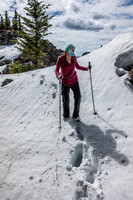 Hann follows through the small gap on the ridge.