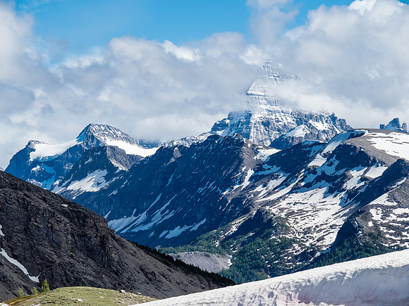 The Matterhorn of the Rockies peeks out from the clouds.