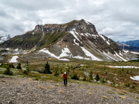 Phil on the lower west slope of Fatigue with Citadel Peak in the background.