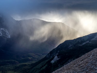 Dramatic back lighting on the storm from the setting sun over Citadel Peak.