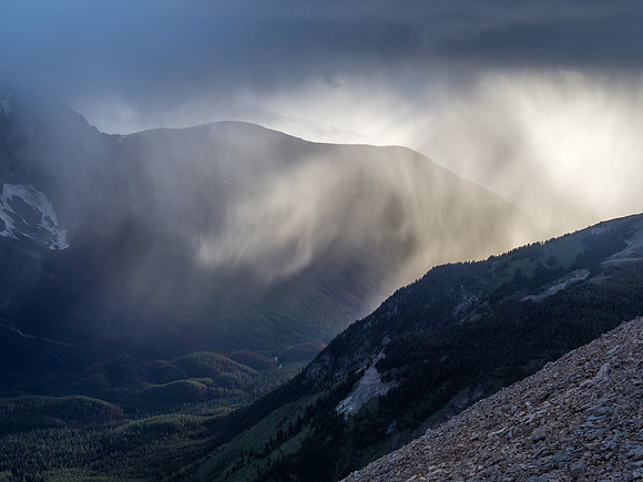 Dramatic back lighting on the storm from the setting sun over Citadel Peak.