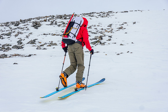 Skiing up wind hammered snow on the south ridge.