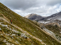 Steep vegetated slopes from the summit with "Little" Fatigue in the background.