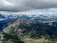 Looking north over Quartz Hill towards the Egypt Lakes with Pharaoh Peak visible and Mount Ball in clouds beyond.