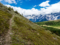 The trail becomes more defined temporarily at the switchbacks. Great views over Citadel Pass at right.
