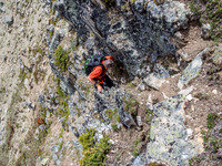 Phil breaks through the easy cliffs - note that if you aren't on the easiest line, there are difficult options through here.