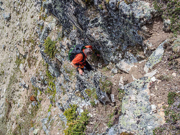 Phil breaks through the easy cliffs - note that if you aren't on the easiest line, there are difficult options through here.