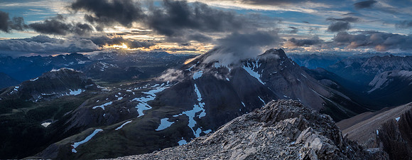 Gorgeous late day lighting and drama over Fatigue Pass with Fatigue Mountain showing a cloud cap.