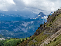 Telephoto of the outlier of Nub Peak with the core Assiniboine area covered in clouds and rain.