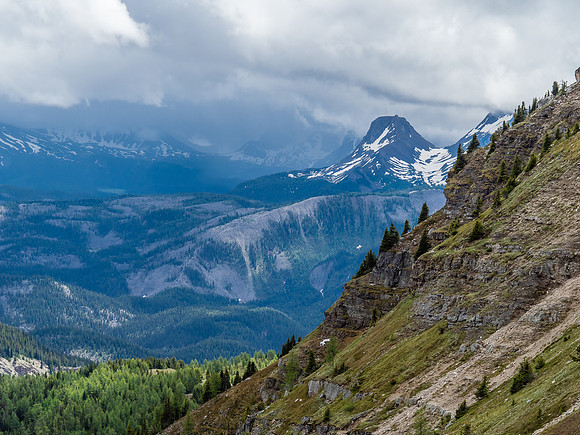 Telephoto of the outlier of Nub Peak with the core Assiniboine area covered in clouds and rain.