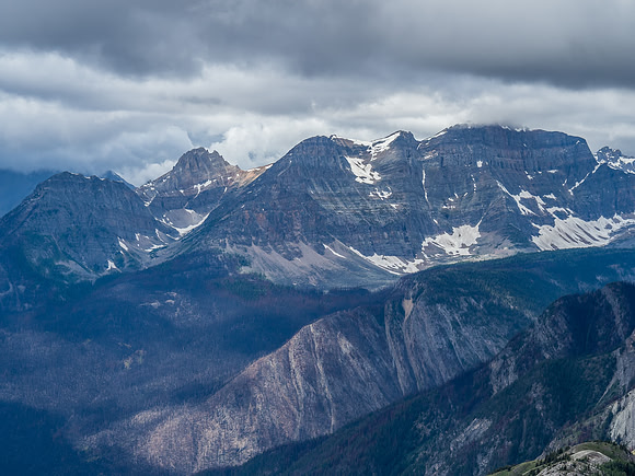 Looking across the recent burn area towards The Monarch which is buried in clouds.