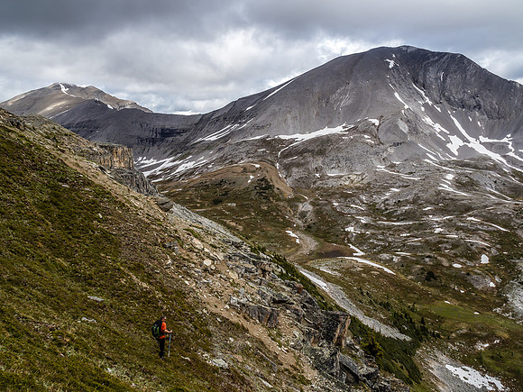 Steep vegetated slopes from the summit with "Little" Fatigue in the background.