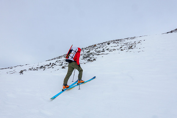 Skiing up wind hammered snow on the south ridge.