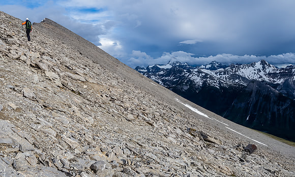 Surreal lighting as we continue to work our way along the never ending summit ridge of Golden Mountain - Assiniboine still showing at center distance.