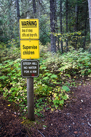 I think people shouldn't do a wilderness trip if they need this much hand holding... The steep hill sign is a good idea though.