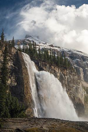 An amazing scene of power and beauty. Emperor Falls with the lower part of Robson's Emperor Ridge towering in the swirling clouds above.