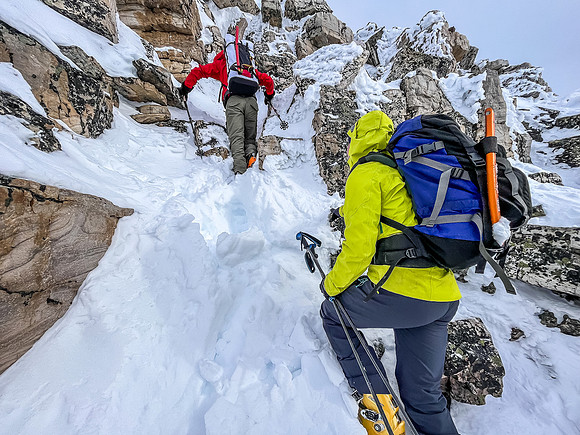Ascending the crux outcrop on the south ridge.