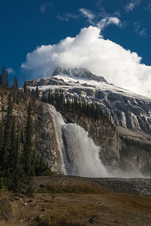 An amazing scene of power and beauty. Emperor Falls with the lower part of Robson's Emperor Ridge towering in the swirling clouds above.