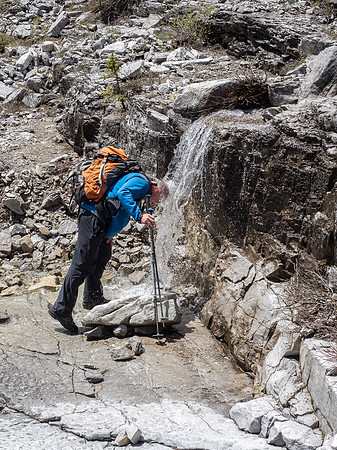 Kev cools off in the creek - only 1.5 hours ago we were freezing in a snow squall! You gotta love mountain weather.